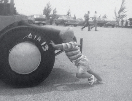 Child Pushing a Tire